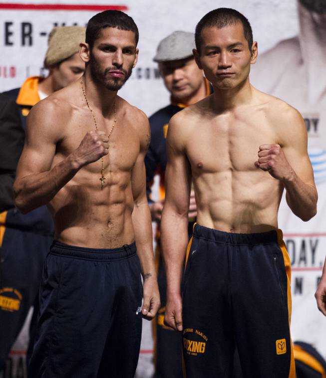 Lightweights Jorge Linares of Venezuela and Nihito Arakawa of Japan pose off for the crowd following their weigh-ins at the MGM Grand Arena on Friday, March 07, 2014.